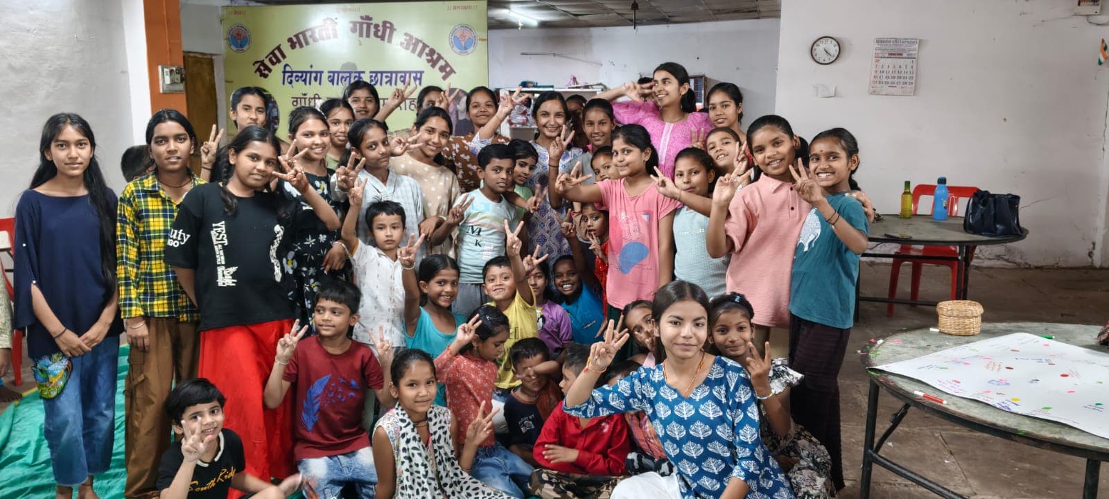 Children and volunteers gathered after a community session at Gandhi Ashram